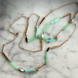 Kendra Scott rose gold necklace with green stones and abalone.